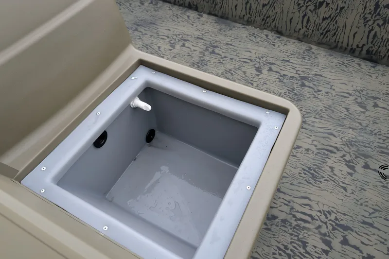 Slide: The Image of Livewell compartment in 2026 Tracker Grizzly 1648 SC boat, featuring durable interior design. - 14
