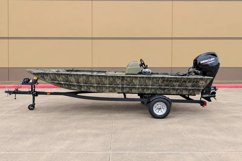 The Image of 2026 Tracker Grizzly 1648 SC boat on trailer, camo design, Mercury outboard motor. - 0