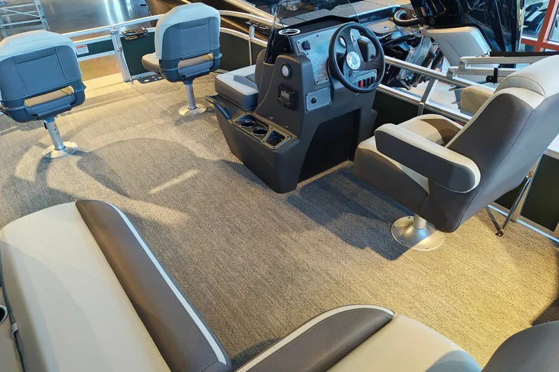 Slide: The Image of 2027 Sun Tracker Bass Buggy 16 XL Select interior with seating and steering console. - 36
