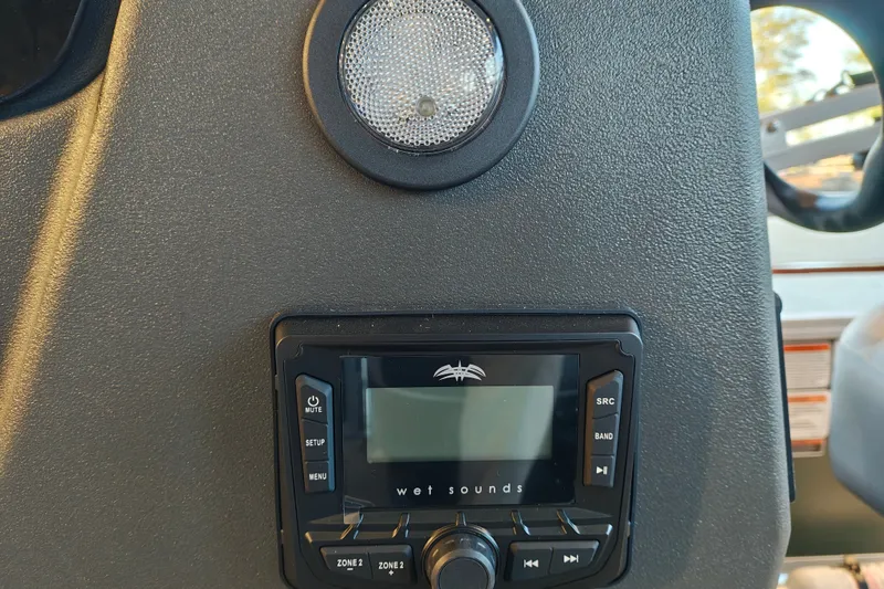 Slide: The Image of 2027 Sun Tracker Bass Buggy 16 XL Select dashboard with Wet Sounds audio system. - 16