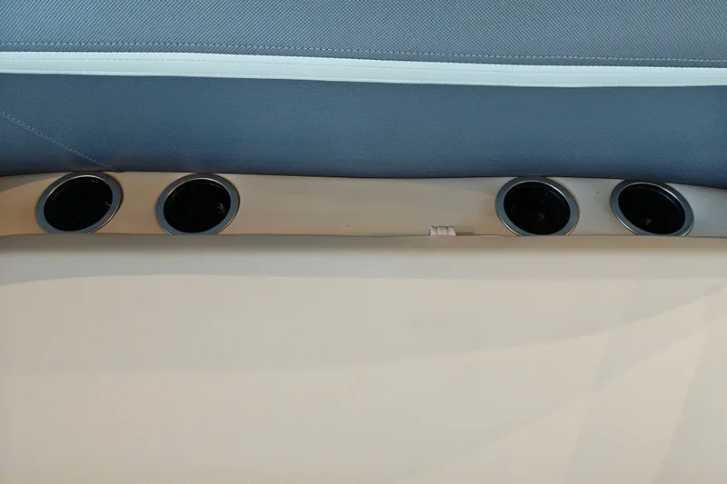 Slide: The Image of Cup holders on Sun Tracker Bass Buggy 16 XL Select, 2027 model, with blue and beige upholstery. - 29