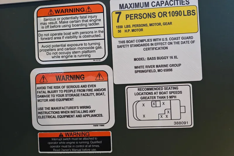 Slide: The Image of Warning labels and capacity information for 2027 Sun Tracker Bass Buggy 16 XL Select boat. - 24