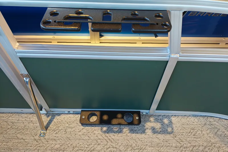 Slide: The Image of 2027 Sun Tracker Bass Buggy 16 XL Select boat interior with cup holders and railing. - 27