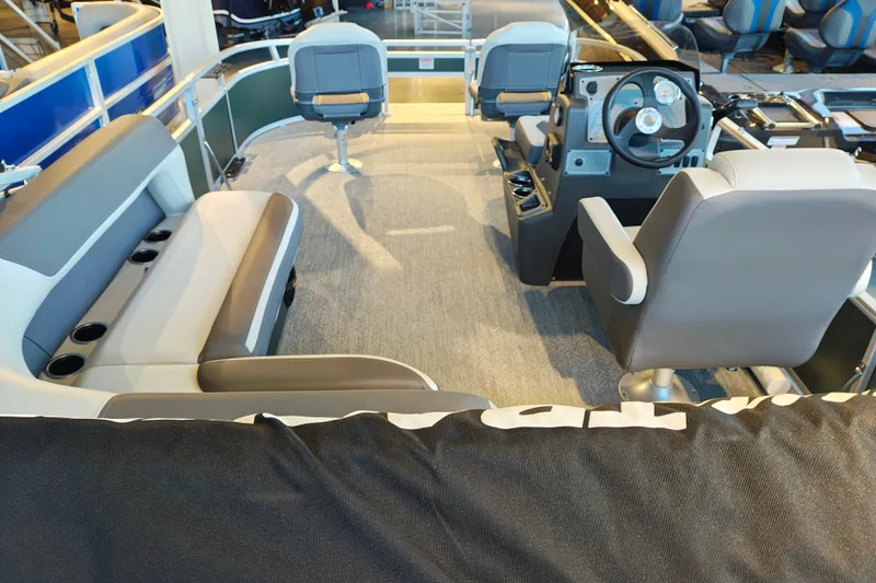 Slide: The Image of Interior of 2027 Sun Tracker Bass Buggy 16 XL Select pontoon boat with seating and steering console. - 35