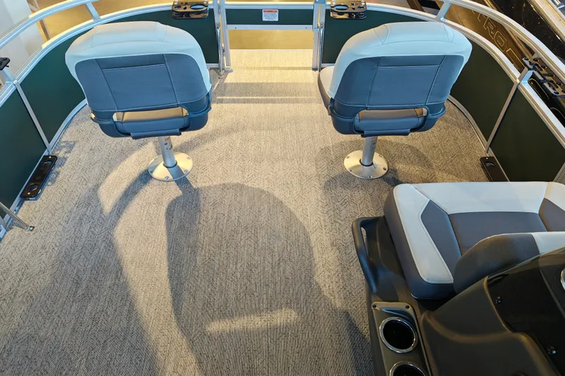 Slide: The Image of 2027 Sun Tracker Bass Buggy 16 XL Select interior with swivel seats and carpeted flooring. - 38