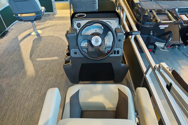 Slide: The Image of Interior view of 2027 Sun Tracker Bass Buggy 16 XL Select pontoon boat helm. - 19