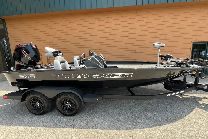 The Image of 2027 Tracker Savage 215 boat on trailer, parked outdoors. - 0