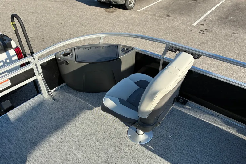 Slide: The Image of 2027 Sun Tracker Bass Buggy 18 DLX pontoon boat with seating and control panel. - 15