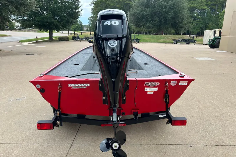 Slide: The Image of 2027 Tracker Panfish 17 boat with Mercury 40 engine, parked outdoors. - 15