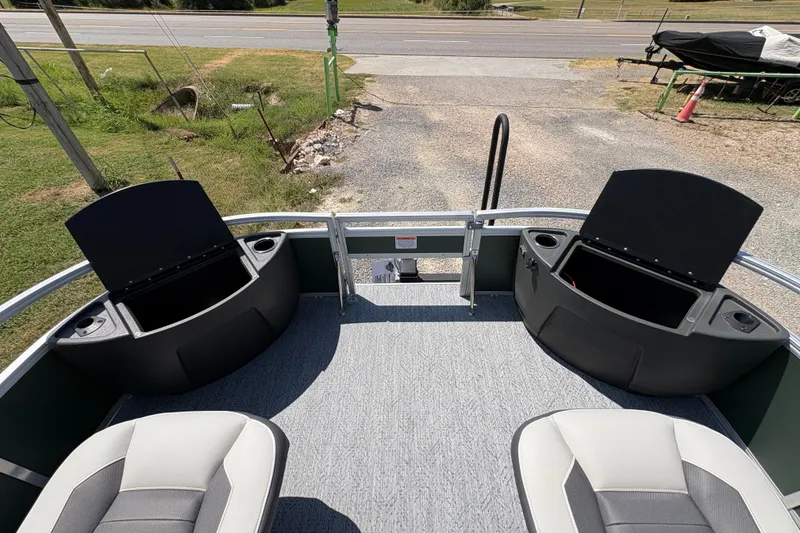 Slide: The Image of 2027 Sun Tracker Bass Buggy 18 DLX pontoon boat interior with open storage compartments. - 13