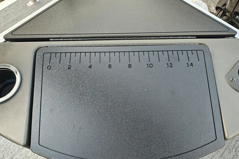Slide: The Image of Ruler on Sun Tracker Bass Buggy 18 DLX 2027 boat dashboard with cup holder. - 16