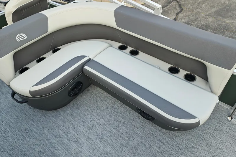 Slide: The Image of 2027 Sun Tracker Bass Buggy 18 DLX boat seating with cup holders and gray upholstery. - 14