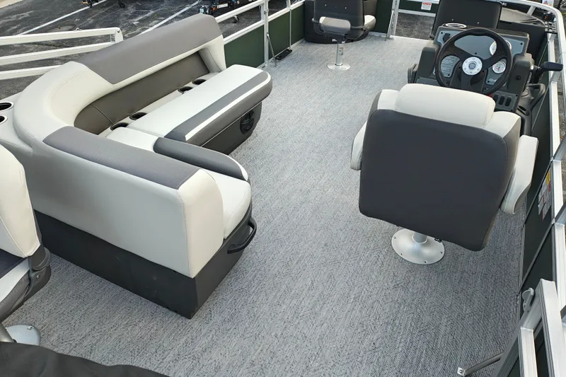 Slide: The Image of Interior of 2027 Sun Tracker Bass Buggy 18 DLX pontoon boat with seating and steering console. - 21