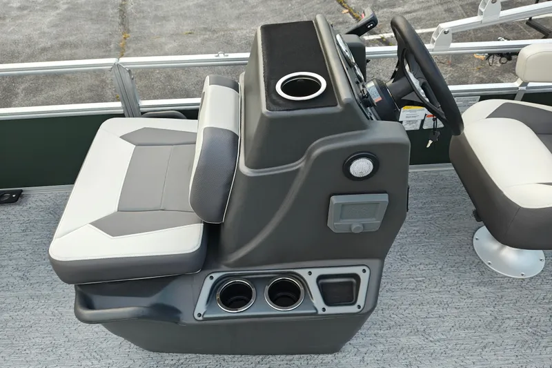 Slide: The Image of 2027 Sun Tracker Bass Buggy 18 DLX boat interior with steering console and seating. - 27