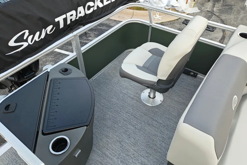 Slide: The Image of 2027 Sun Tracker Bass Buggy 18 DLX interior with seating and fishing station. - 15