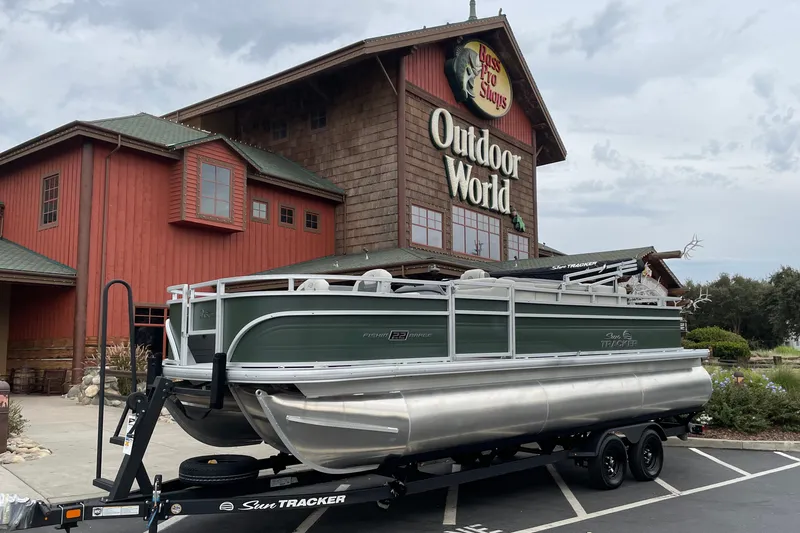 The Image of 2027 Sun Tracker Fishin' Barge 22 XP3 pontoon boat at Outdoor World store. - 0