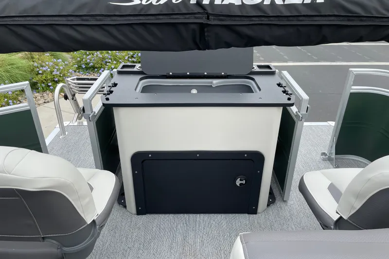 Slide: The Image of 2027 Sun Tracker Fishin' Barge 22 XP3 interior with seating and storage area. - 20