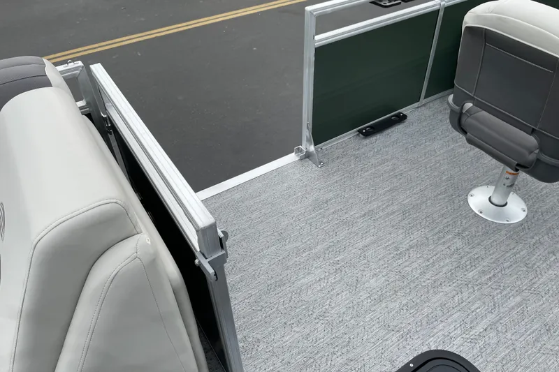 Slide: The Image of 2027 Sun Tracker Fishin' Barge 22 XP3 interior with seating and carpeted floor. - 28
