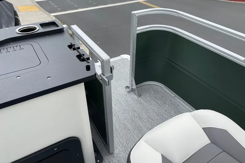 Slide: The Image of 2027 Sun Tracker Fishin' Barge 22 XP3 interior with seating and railing details. - 14
