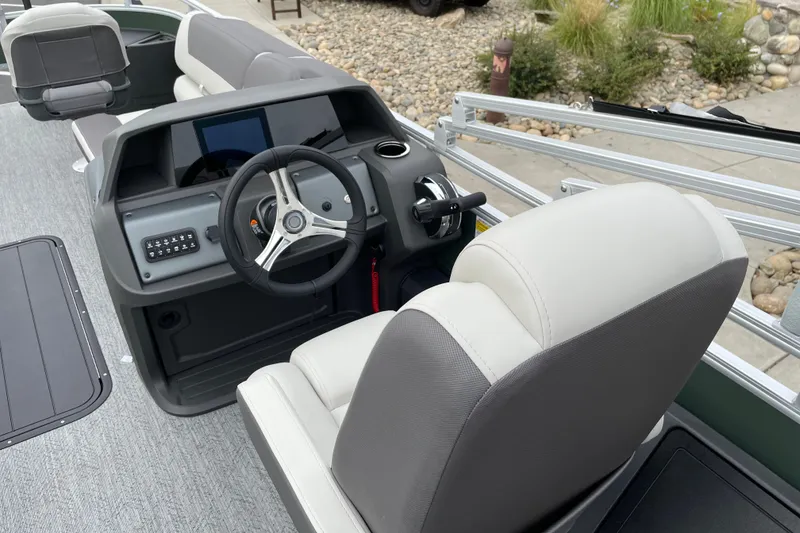 Slide: The Image of Interior of 2027 Sun Tracker Fishin' Barge 22 XP3 with steering console and seating. - 25