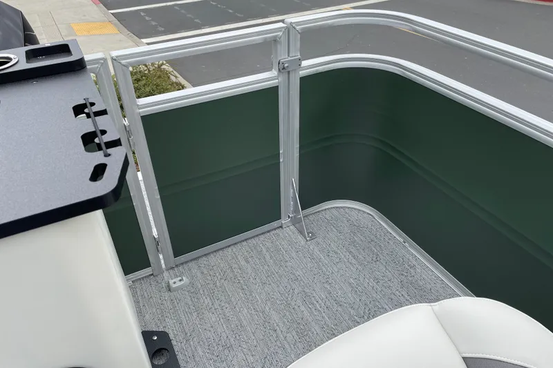 Slide: The Image of Interior view of 2027 Sun Tracker Fishin' Barge 22 XP3 pontoon boat with seating and railing. - 13