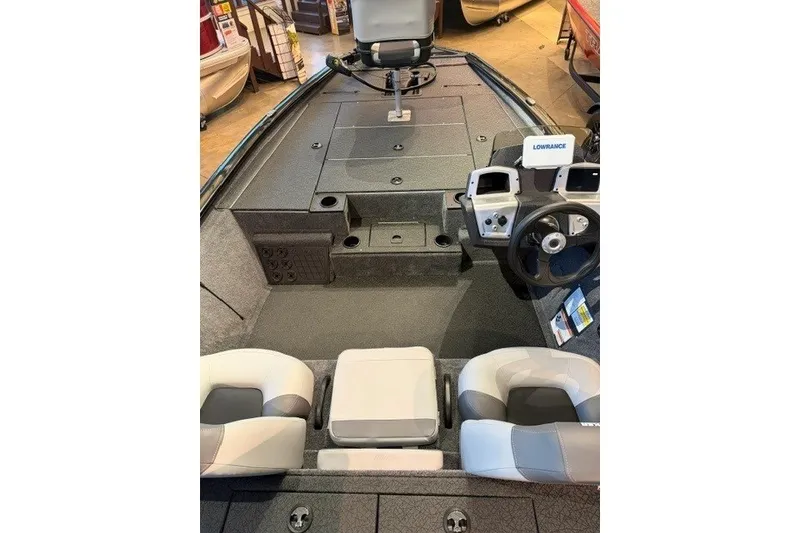 Slide: The Image of Interior view of 2027 Tracker Savage 215 boat with seating and control panel. - 48
