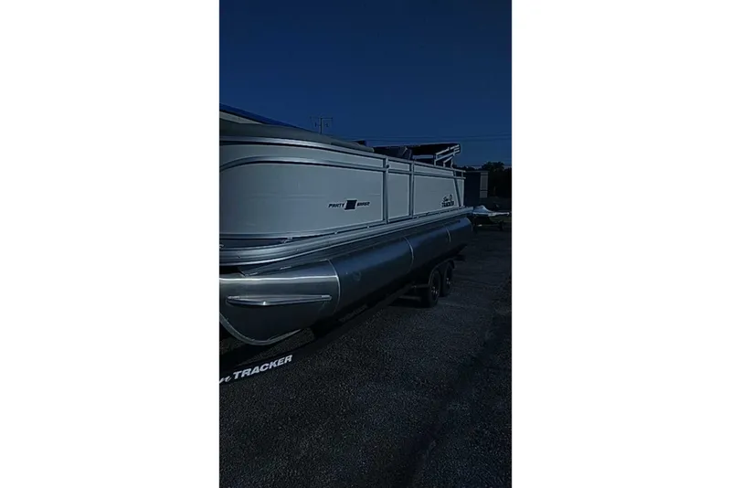 The Image of 2027 Sun Tracker Party Barge 22 RF XP3 pontoon boat on trailer. - 0