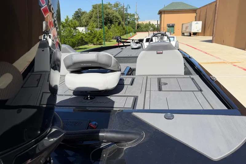 Slide: The Image of 2027 Tracker Savage 215 boat interior with sleek seating and modern design. - 15