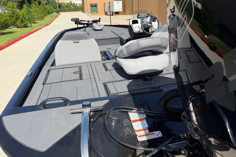 Slide: The Image of 2027 Tracker Savage 215 boat interior with seating and control panel. - 14