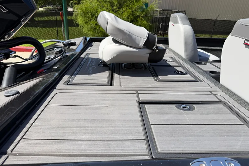 Slide: The Image of 2027 Tracker Savage 215 boat deck with seating and storage compartments. - 17