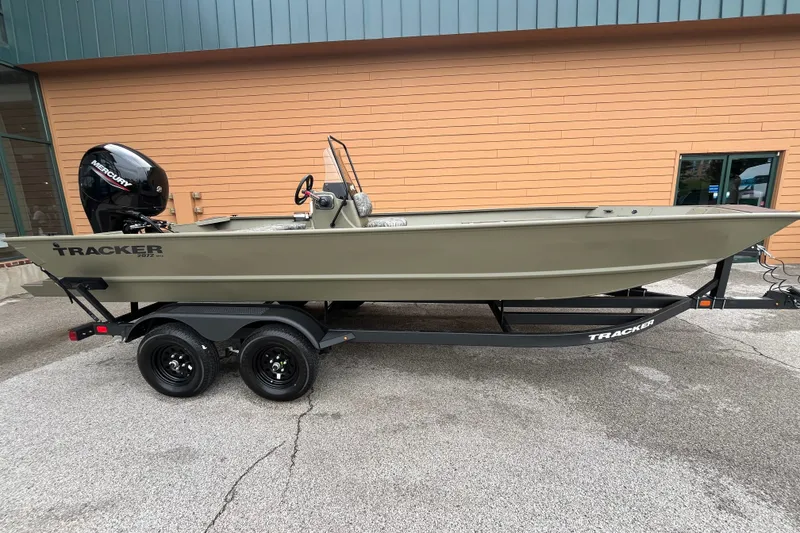 The Image of 2027 Tracker Grizzly 2072 CC boat on trailer, parked outdoors. - 0