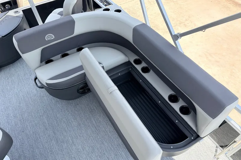 Slide: The Image of 2027 Sun Tracker Bass Buggy 18 DLX pontoon boat seating with storage and cup holders. - 26