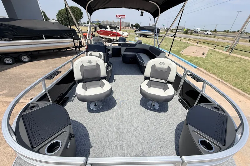 Slide: The Image of 2027 Sun Tracker Bass Buggy 18 DLX pontoon boat with spacious seating and modern design. - 17