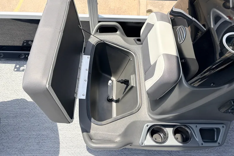 Slide: The Image of 2027 Sun Tracker Bass Buggy 18 DLX boat seat storage compartment with cup holders. - 20