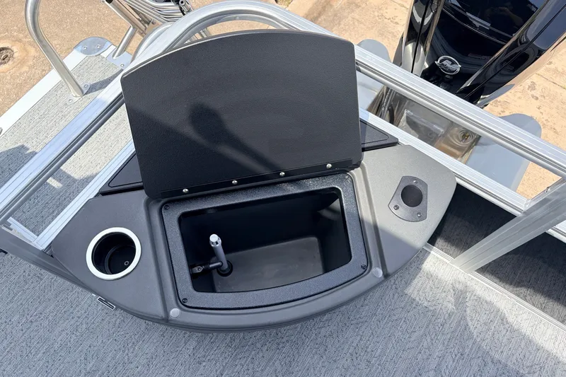 Slide: The Image of Open storage compartment on 2027 Sun Tracker Bass Buggy 18 DLX pontoon boat deck. - 31