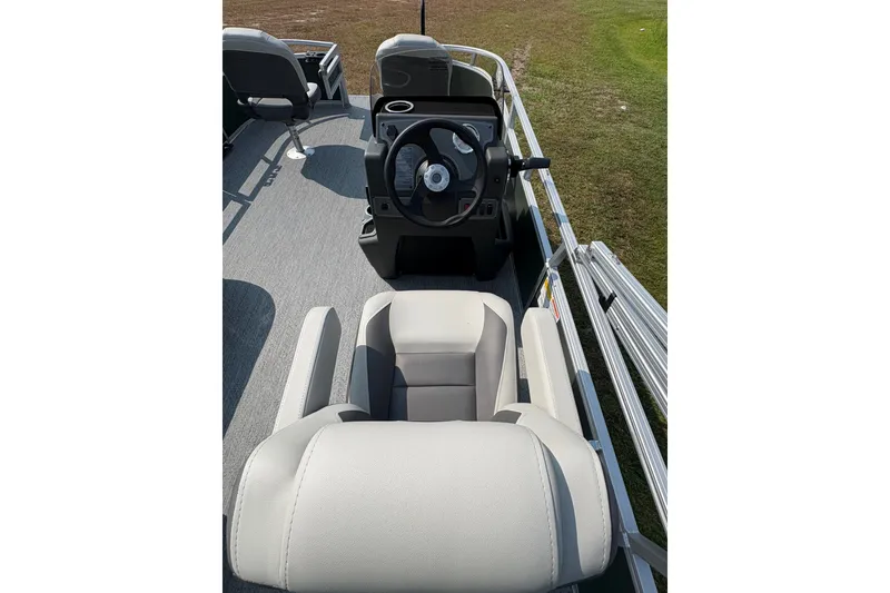 Slide: The Image of 2027 Sun Tracker Bass Buggy 16 XL Select boat interior with steering console and seating. - 71