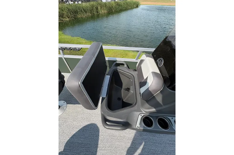 Slide: The Image of 2027 Sun Tracker Bass Buggy 16 XL Select boat seat with storage compartment open. - 69