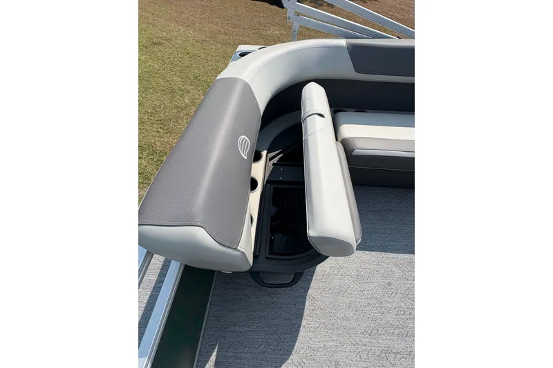 Slide: The Image of 2027 Sun Tracker Bass Buggy 16 XL Select pontoon boat seating with storage compartment. - 73