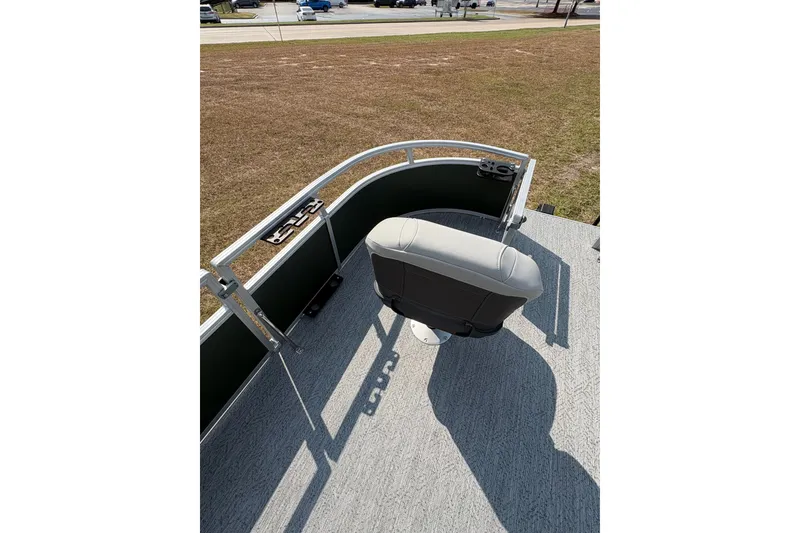 Slide: The Image of 2027 Sun Tracker Bass Buggy 16 XL Select boat deck with swivel seat and railing. - 66