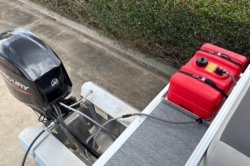 Slide: The Image of Outboard motor and fuel tanks on 2027 Sun Tracker Bass Buggy 16 XL Select boat. - 25