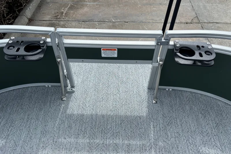 Slide: The Image of 2027 Sun Tracker Bass Buggy 16 XL Select boat deck with cup holders and railing. - 21