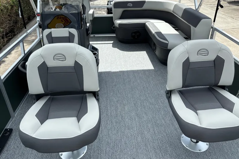 Slide: The Image of 2027 Sun Tracker Bass Buggy 16 XL Select interior with gray seating and spacious layout. - 15