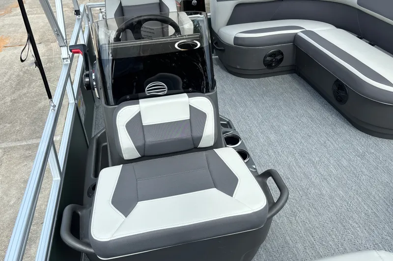 Slide: The Image of 2027 Sun Tracker Bass Buggy 16 XL Select interior with seating and steering console. - 14