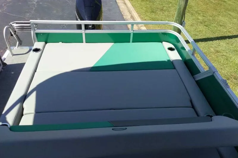 Slide: The Image of 2027 Sun Tracker Party Barge 22 RF XP3 with green and gray seating area. - 15