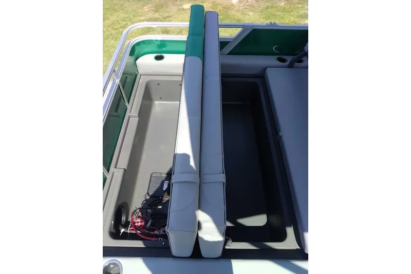 Slide: The Image of 2027 Sun Tracker Party Barge 22 RF XP3 interior storage compartment with seating. - 16