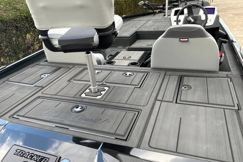 Slide: The Image of 2027 Tracker Savage 215 boat interior with seating and storage compartments. - 17