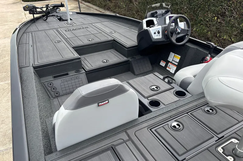 Slide: The Image of 2027 Tracker Savage 215 boat interior with seating and control console. - 24