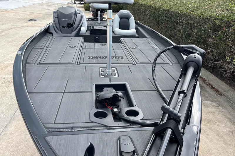 Slide: The Image of 2027 Tracker Savage 215 boat with sleek deck and advanced trolling motor. - 13
