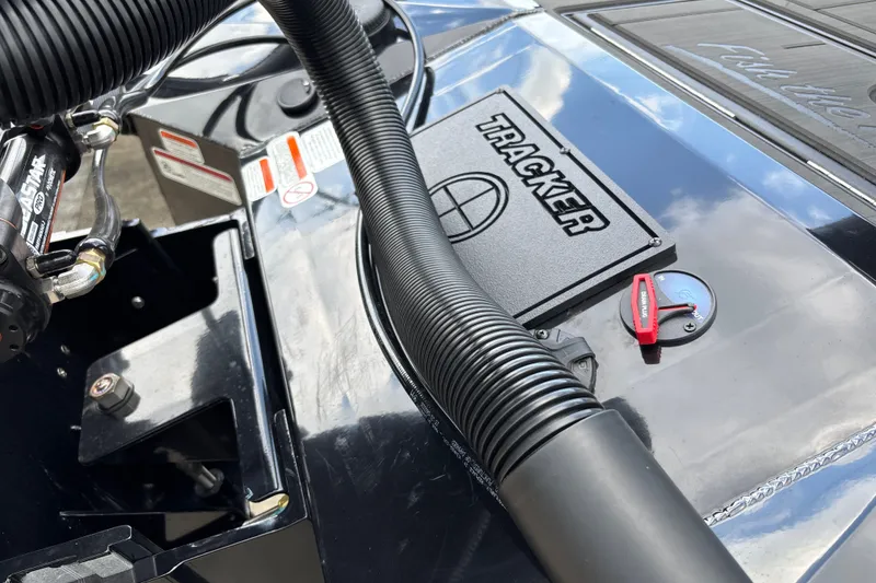 Slide: The Image of Close-up of 2027 Tracker Savage 215 boat engine components and branding. - 23