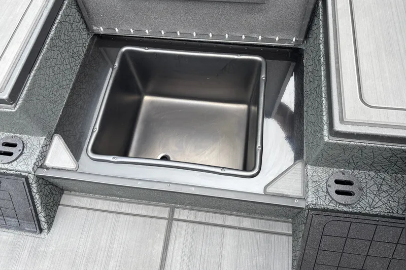 Slide: The Image of Stainless steel compartment in 2027 Tracker Savage 215 boat interior. - 29